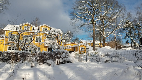 Yellow house in a snowy landscape